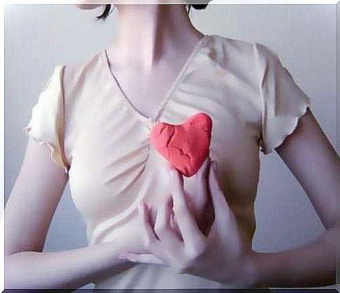 Woman holding a heart figure