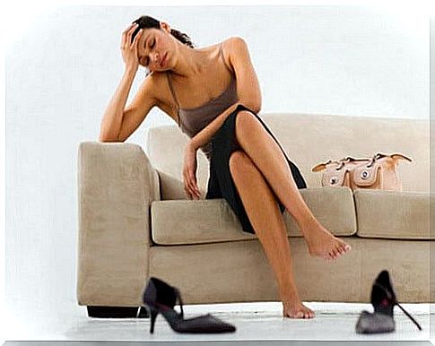 Woman sitting on the sofa and tired