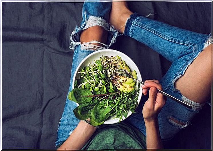 Woman eating salad