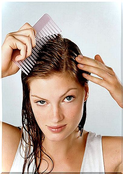 Woman arranging her hair