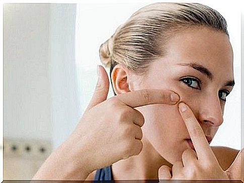 Woman having two fingers on her cheek