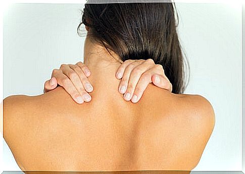 Woman massaging her neck.