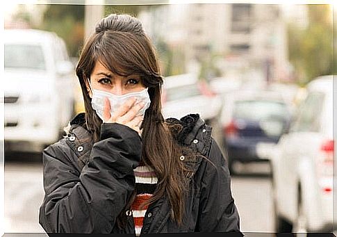 Woman wearing mask for mouth outside