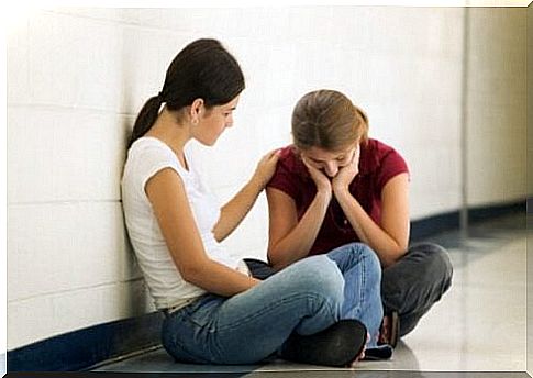 Woman comforting her friend