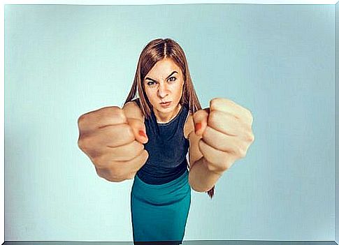 Woman holding her fists forward