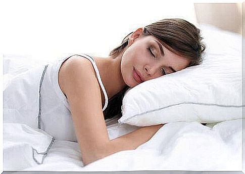 Woman sleeping in clean bed