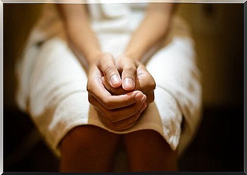 Woman sitting on the toilet