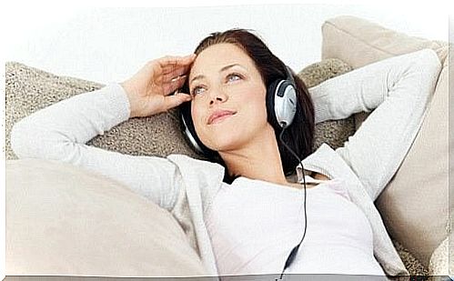 Woman lying and listening to music