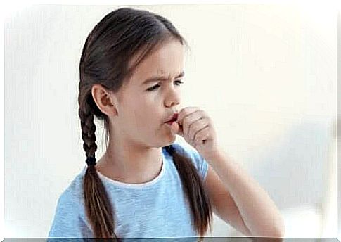 Girl coughing in her hand