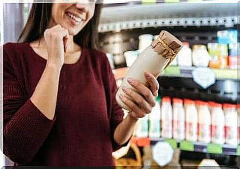 Woman with yogurt in hand