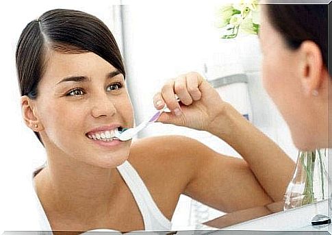 Woman brushes teeth