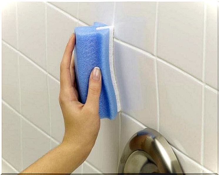 Person scrubbing tiles