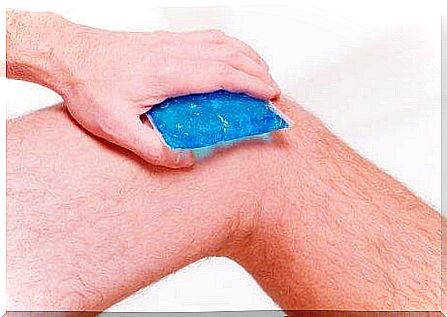 A man has an ice pack on his knee