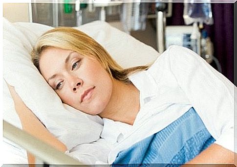 Woman lying in hospital bed